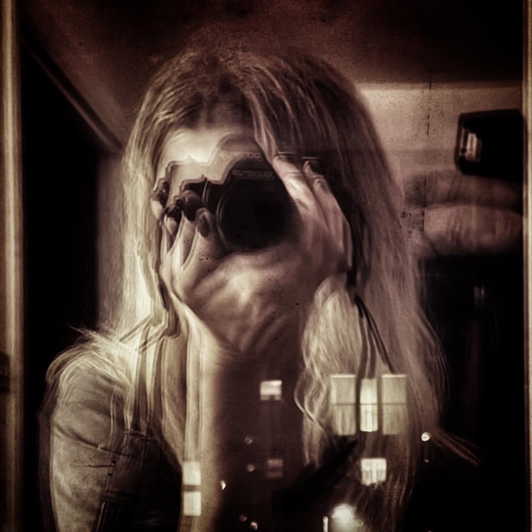 Marta, reflected with her camera in a sepia-toned double exposure